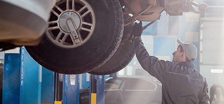 Man inspecting car